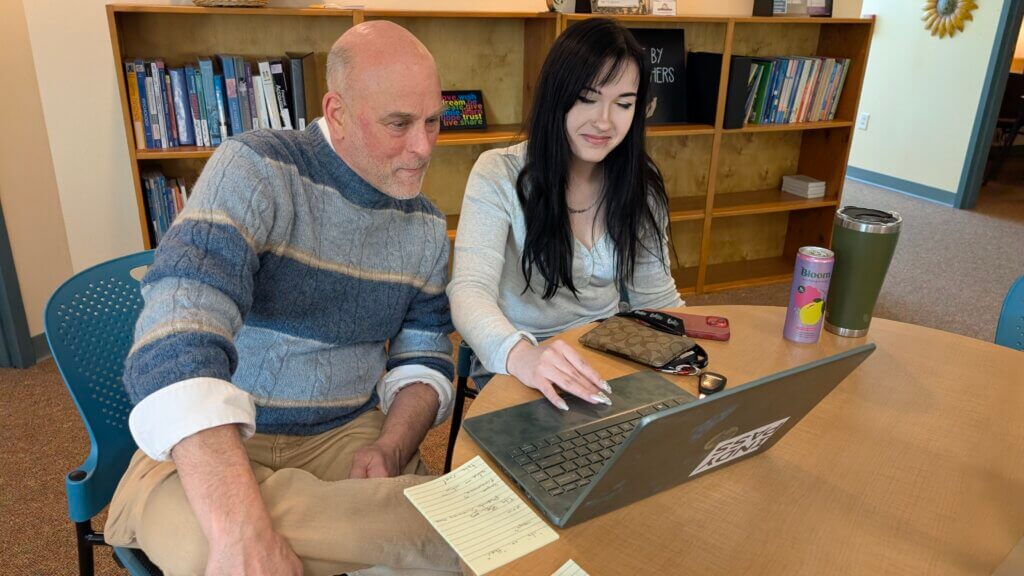 Writing Specialist tutoring a student in CAPS.